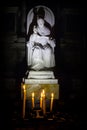 Candles in front of the statue Pope Saint Pius X inside the church San Salvador, Venice, Italy Royalty Free Stock Photo