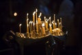 The candles in Georgian Church. Long lighted candles group Royalty Free Stock Photo