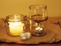 Candles in glass burning romantic celecration concept wooden kitchen Royalty Free Stock Photo