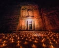 Candles glowing in front of the Al Khazneh temple (The Trasury) in the ancient city Petra, Jord