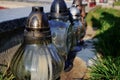 Candles on the grave in the cemetery / graveyard. All Saints Day / All Hallows / 1st November Royalty Free Stock Photo