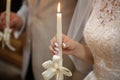 Candles in hand of wedding ceremony