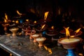 Candles for holy ritual on the altar at the buddhist temple Royalty Free Stock Photo