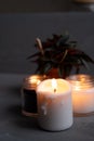 Candles. Home interior decoration. Romantic candles. White and black wax. In glass jars. Romantic atmosphere at home. Royalty Free Stock Photo