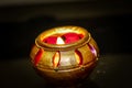 Candles kept in decorative earthen pot for home decor Royalty Free Stock Photo