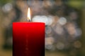 Candles light. Christmas candle burning at night. Abstract candle background. Golden light of candle flame. Closeup of a red Royalty Free Stock Photo