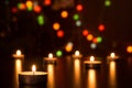 Christmas candles burning at night. Abstract candles background. Golden light of candle flame. Hope, fire. Royalty Free Stock Photo