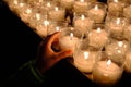 Candles lighting church and children offering coin Royalty Free Stock Photo