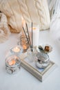 Candles with lights. composition on the windowsill. cute home decor with candles and aroma stick. Calmness relax, unplug,