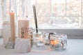 Candles with lights. composition on the windowsill. cute home decor with candles and aroma stick. Calmness relax, unplug, Royalty Free Stock Photo