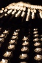 Candles lit in a Christian shrine for spiritual offerings