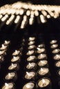 Candles lit in a Christian shrine for spiritual offerings