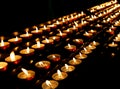 candles lit inside the place of worship to pray Royalty Free Stock Photo