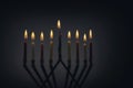 Candles lit for night of hanukkah with burning candles for holiday