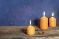 Candles on an old wooden table. Halloween background.Space for text Royalty Free Stock Photo