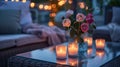 Candles and pink roses on a glass table in a cozy evening setting. Royalty Free Stock Photo