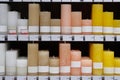 Candles for sale in interior decorating store. Variety natural colors aroma candles in large candle shop. Discounts on price tags
