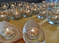 Candles in small glasses and boats during the vigil ceremony and prayer