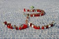 Candles on the street arranged in the shape of a symbol of Warsaw Uprising in 1944 Royalty Free Stock Photo