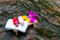 Candles, towels, oils, massage and spa set on a wooden table at Royalty Free Stock Photo