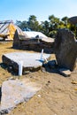 candles on a traditional stone grave in Flores, Indonesia