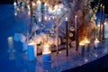 Wedding decor dark. Candles, white dried flowers Royalty Free Stock Photo