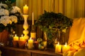Candles and yellow textile arrangement