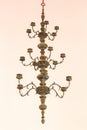 Candlestick, old brass, hanging on the ceiling