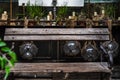 Candlestick and plant pot on wooden table with Wooden chair for sit back relax