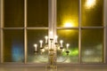 Candlestick on window ledge