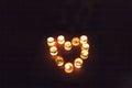 Candlesticks with burning candles in the form of a heart Royalty Free Stock Photo