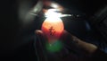 Candling chicken egg to find fertilized egg with light candle an egg