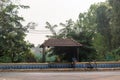 A bicycle parked outside a vintage bus stop in the village of Sinquerim