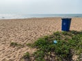 A garbage bin on a pristine beach in the village of Sinquerim in Goa