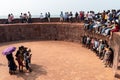 A large group of Indian tourists posing for a photograph at the Portuguese era fort in