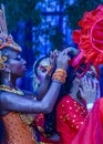 Candombe vedette arranging the hair of a partner, calls parade, montevideo, uruguay Royalty Free Stock Photo