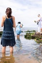 Candomble people enter the waters of Rio Vermelho beach to offer gifts to Yemanja