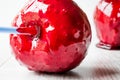 Candy Apples on white wooden surface. Ready to Eat Royalty Free Stock Photo