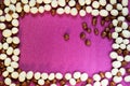 Candy background, white pebbles stone sweet raisins glazein the form of a frame Royalty Free Stock Photo