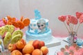 Candy bar, birthdaycake for a girl with Frozen cartoon character illustration. Muffins, peaches and flowers Royalty Free Stock Photo
