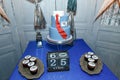 Candy bar with cupcakes, birthday cake with suit and tie design for a teenage boy, the Russian inscription reads Create Yourself.