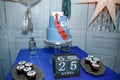 Candy bar with cupcakes, birthday cake with suit and tie design for a teenage boy, the Russian inscription reads Create Yourself.