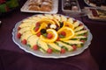 Candy bar.Different delicious fruits on wedding reception table with bananas and grapes Royalty Free Stock Photo