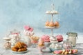 Candy bar with different sweets on white marble table