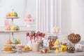 Candy bar with different sweets on white table