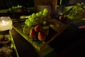 Candy bar set up on wedding table with fruits, grapes, strawberries, brownies Royalty Free Stock Photo