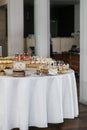 Candy bar. Table with sweets, candies, and dessert. Wedding event