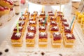 Sweet candy bar.Different delicious cake on wedding reception table with bananas and grapes Royalty Free Stock Photo