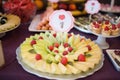 Candy bar.Different delicious fruits on wedding reception table with bananas and grapes Royalty Free Stock Photo