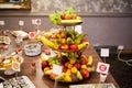 Candy bar.Different delicious fruits on wedding reception table with bananas and grapes Royalty Free Stock Photo